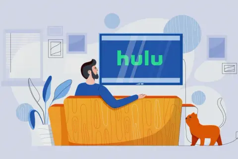 Mężczyzna z kotem relaksuje się na kanapie, oglądając Hulu Polska.