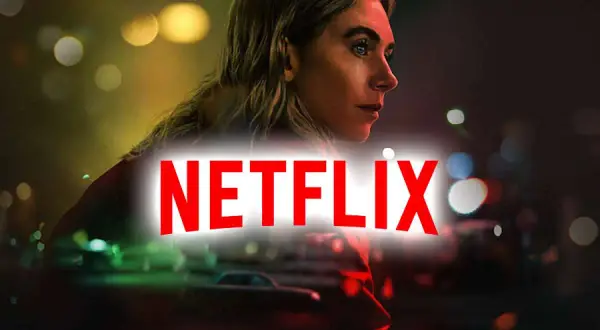 Kobieta w świetle neonów, logo Netflix. Szukasz fajnych filmów na Netflix?