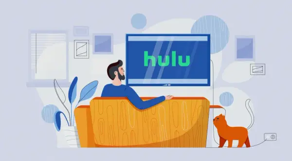 Mężczyzna z kotem relaksuje się na kanapie, oglądając Hulu Polska.