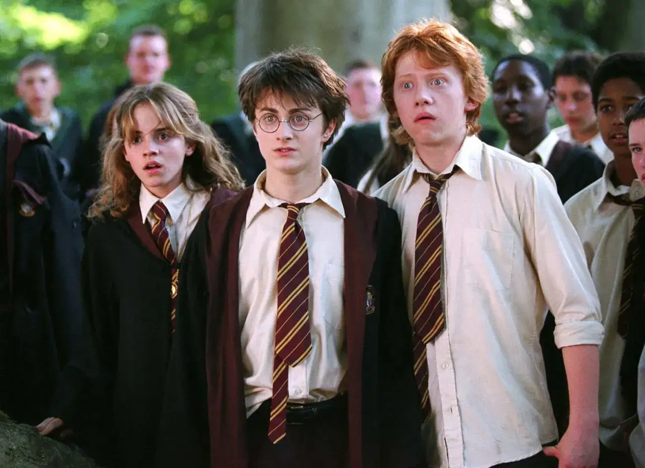 Harry, Ron i Hermiona w szatach Gryffindoru. Obsada 